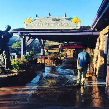 Marketplace walkway being power washed